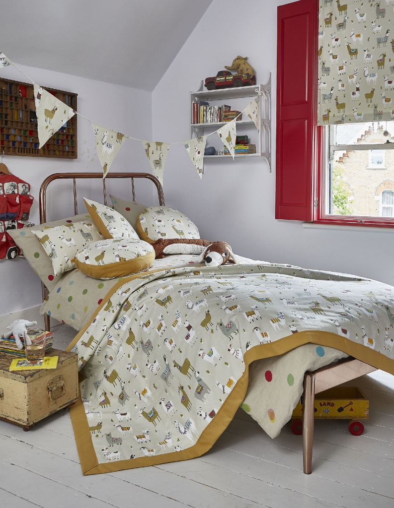 A fun child's room with wine red shutters and patterned Roman blind. 