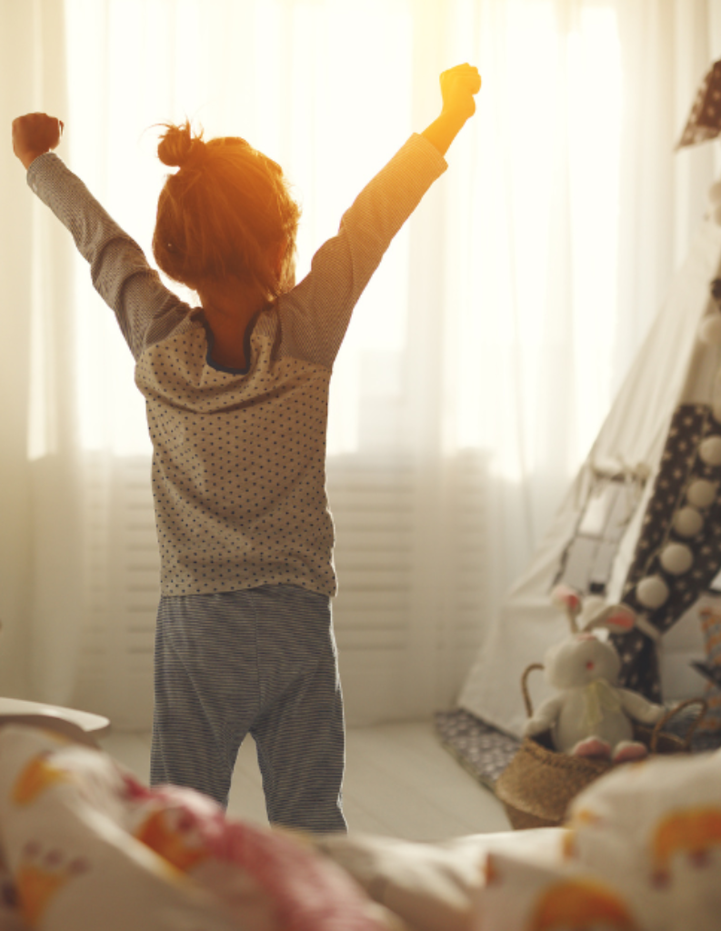 A image of a child waking up in a well designed kid's bedroom