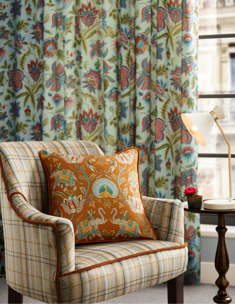 Colourful curtains and cushions in a stylish autumn living room. 