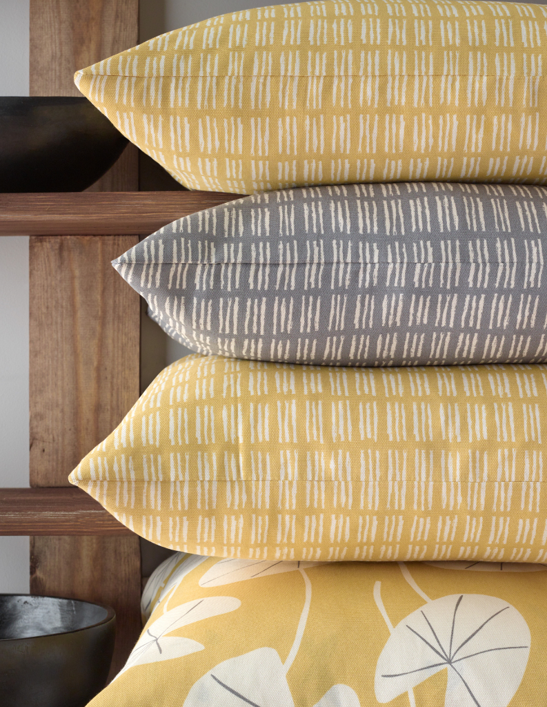 A selection of yellow and grey cushions