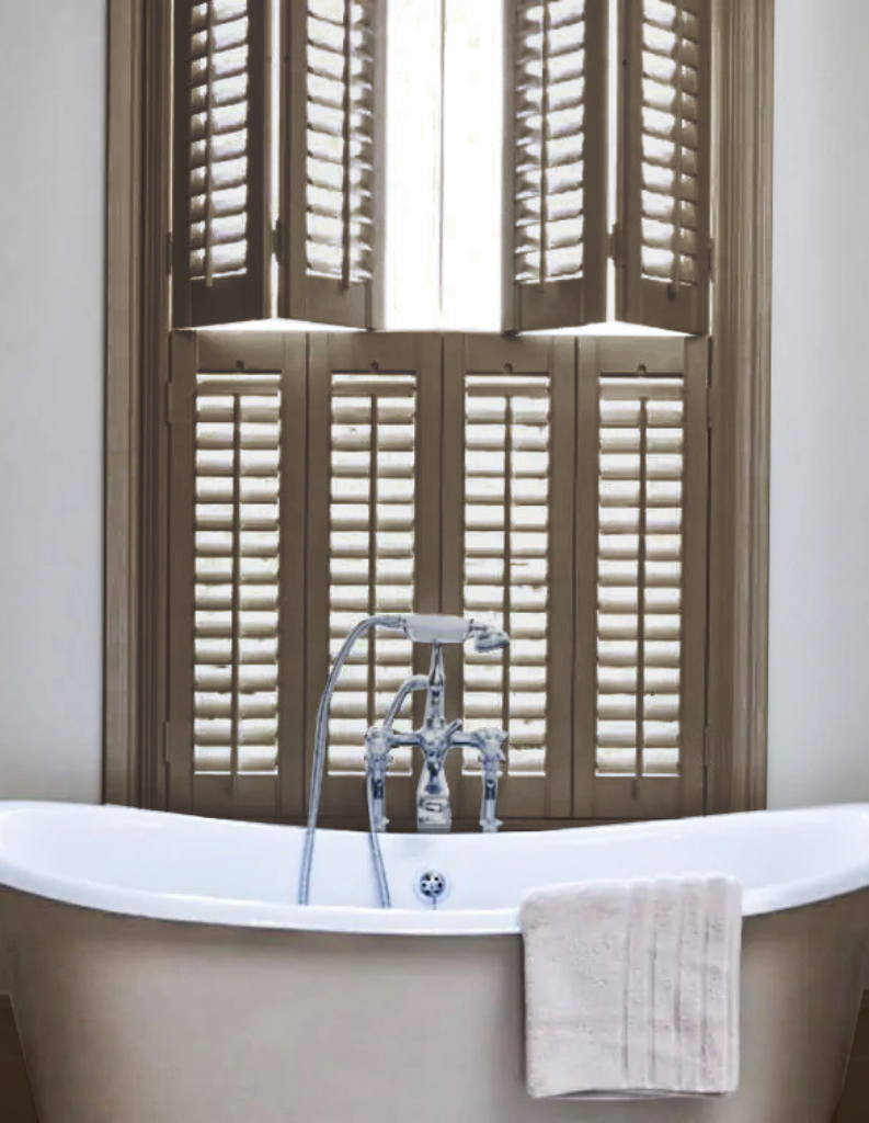 Milk chocolate coloured shutters in a light bathroom. 