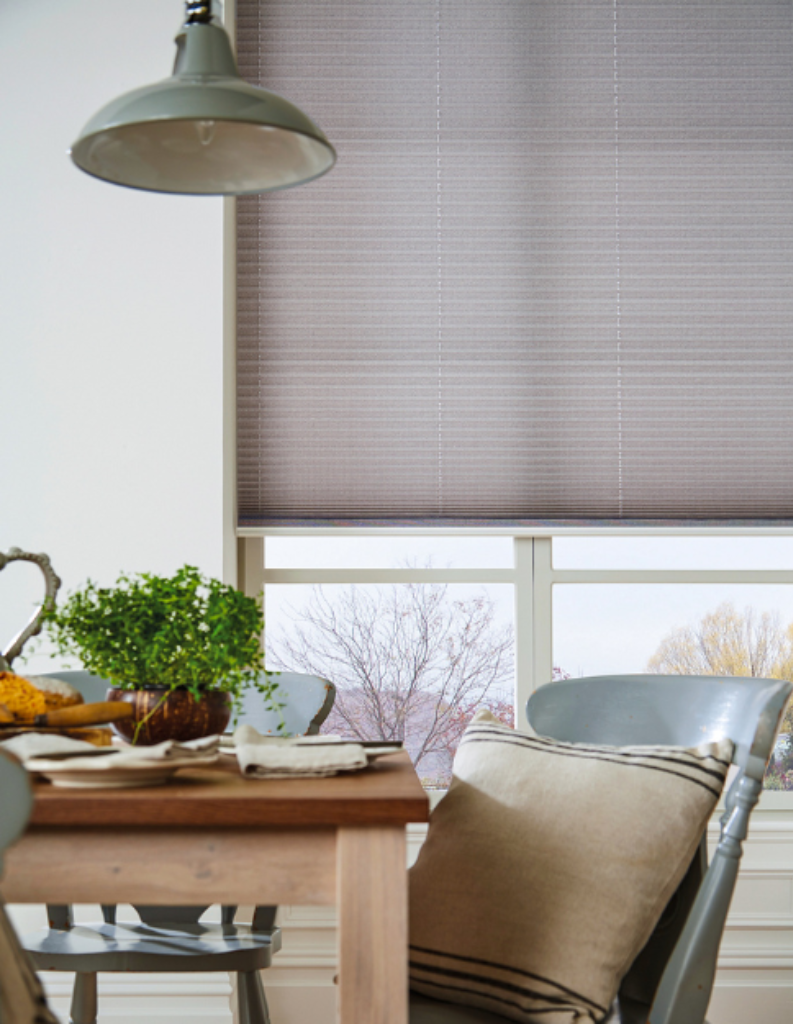 Pleated blinds in a chic dining space.