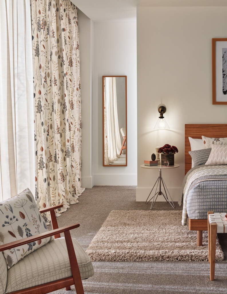 White chocolate colours in a light bedroom with floral curtains. 