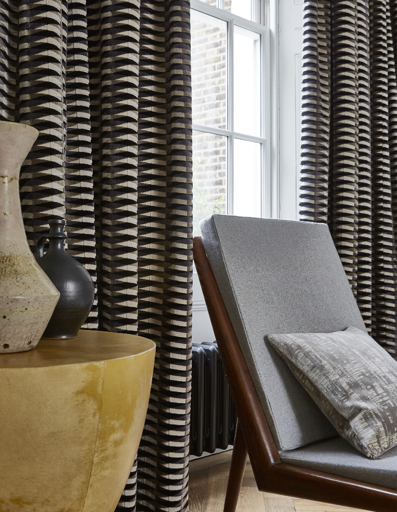 Dark chocolate coloured curtains in a fashionable living room. 